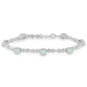 Jewelili Sterling Silver With 7x5 MM Oval Shape Created Opal and Created White Sapphire Bracelet